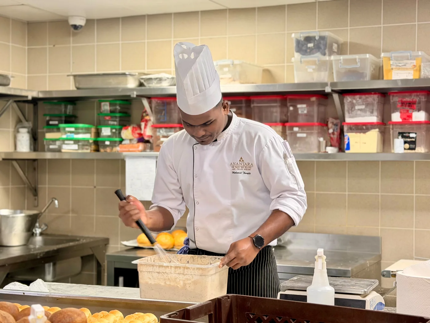 Thawfiq preparing food in a professional kitchen